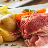 Corned Beef And Cabbage · Thinly sliced and perfectly flavored served with cabbage and Yukon gold potatoes.