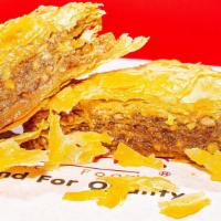 Baklava · Sweet dessert pastry made of layers of film filled with chopped nuts and sweetened with syru...