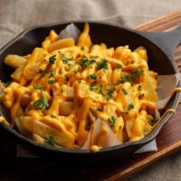 Cheddar Fries · Perfectly golden fries with sharp cheddar cheese.
