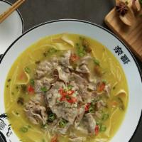 Golden Soup With Fatty Beef (酸辣金汤肥牛) · Pickling hot peppers creates the classic's more spicy-and-sour yellow cousin. Topped with fa...