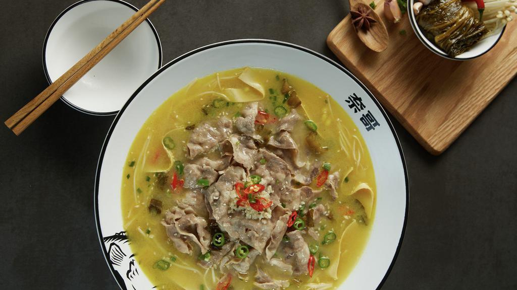 Golden Soup With Fatty Beef (酸辣金汤肥牛) · Pickling hot peppers creates the classic's more spicy-and-sour yellow cousin. Topped with fatty beef for a balanced textural bite. Heat Level: 3