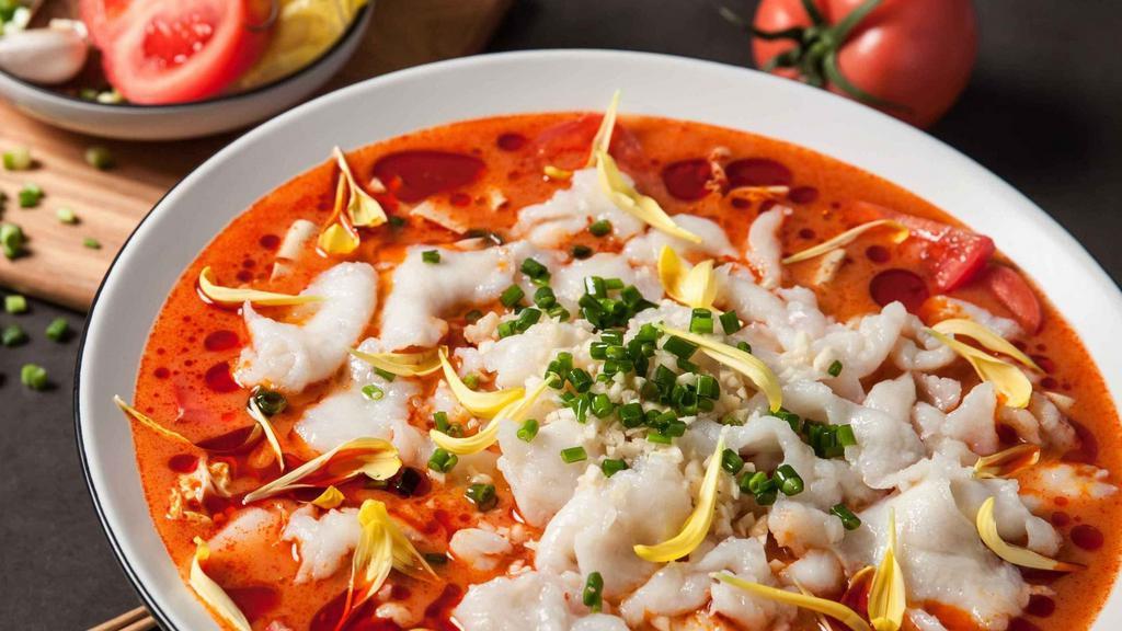 Sun Dried Tomato Soup (日照番茄鱼) · A tomato based soup topped with sliced fish fillets, fresh tomatoes, and an assortment of vegetables a hearty dish for those who don't want spicy food. Heat Level: 0