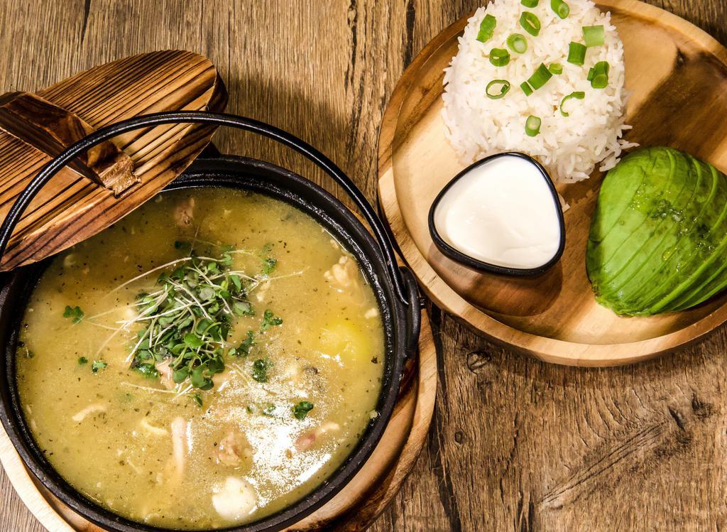 Soup De Jour (Ajiaco) · Hearty colombian chicken soup, yucca, yukon potatoes, sour cream, avocado