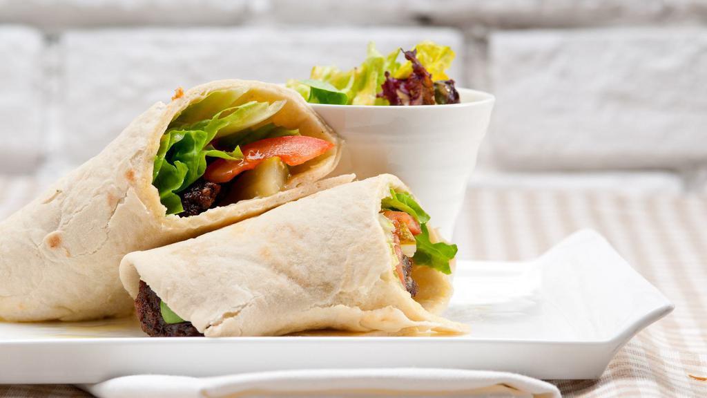 Mediterranean Wrap · Delicious Breakfast Wrap made with Eggs, roasted peppers, feta cheese, Parmesan cheese and black olives. Served on customer's choice of wrap.