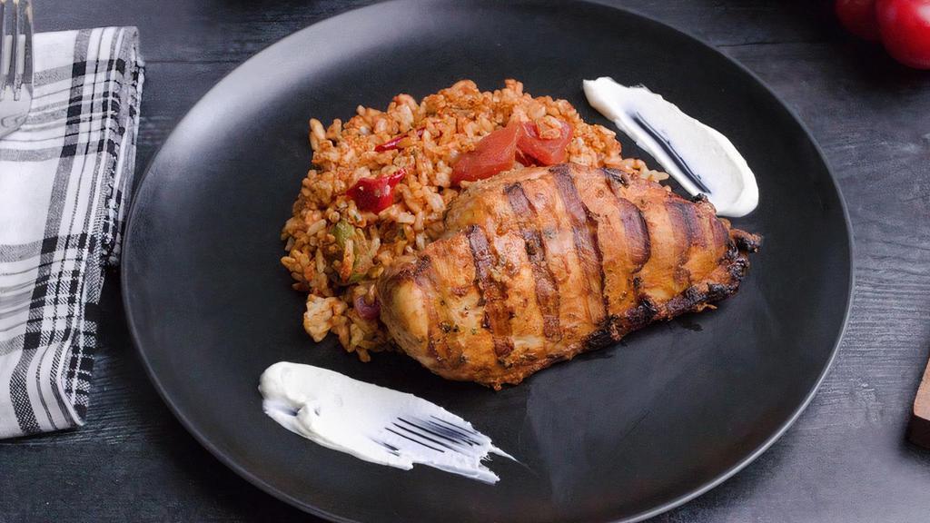 Mediterranean Chicken W/ Quinoa  · Tender grilled chicken breast seasoned with our homemade Mediterranean spice blend, served with grilled peppers, onions, and tomatoes mixed with quinoa. Make it your way with a side of mediterranean dressing and feta cheese.

allergens: dairy