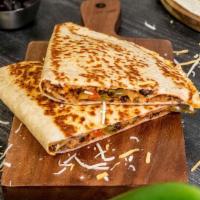 Beef Quesadilla · A gluten-free wrap filled with tender hand-shredded beef tossed with tangy enchilada sauce, ...
