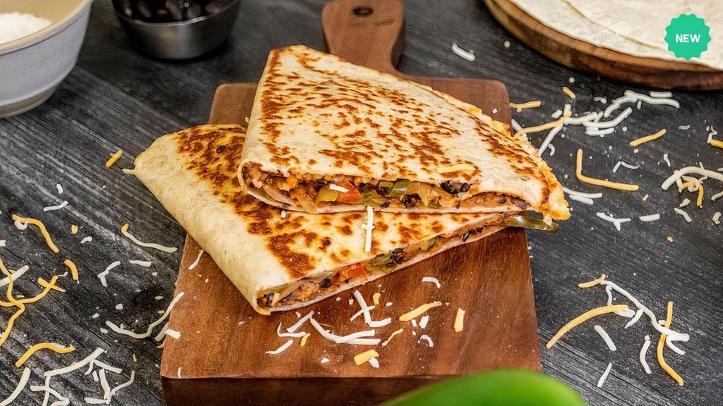 Beef Quesadilla · A gluten-free wrap filled with tender hand-shredded beef tossed with tangy enchilada sauce, sautéed peppers and onions, and low-fat cheese finished on the grill top. Allergens: dairy.