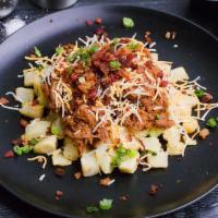Loaded Beef Potato · Slow-cooked flank steak, hand-shredded and tossed with a sweet and smokey honey BBQ sauce. T...