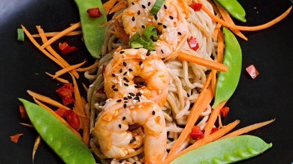 Sesame Ginger Shrimp · 16/20 shrimp lightly seasoned and sautéed in a savory, sweet and spicy taste. Served over soba noodles tossed in sesame ginger sauce. Dressed with shredded carrots, snow peas and diced red bell peppers.
