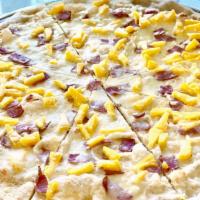 Hawaiian Pizza · With ham and pineapple.