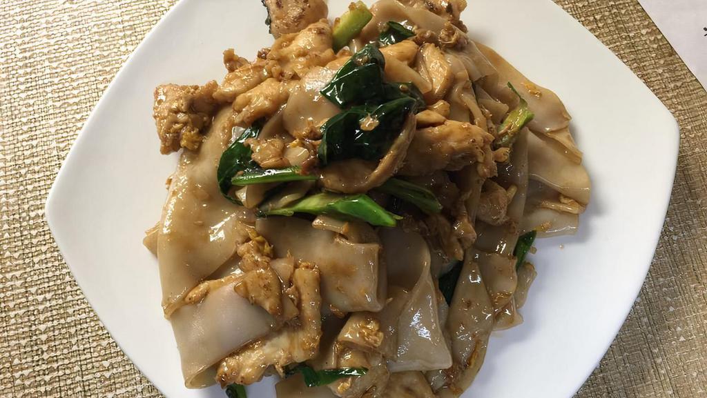 Pad See Yu Chicken · Thai country-style stir-fried broad rice noodles with chinese broccoli and eggs.