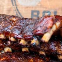 Ribs · Half Rack. Baby Back Pork Ribs. Served with Coleslaw and Pickles