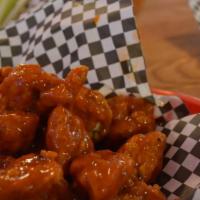 Boneless Buffalo Wings 7Pc · Dipped in your choice of wing sauce, served with blue cheese dressing.