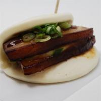 Kakuni Bun · Steamed bun stuffed with braised pork belly cucumber, scallions and chef special sauce.