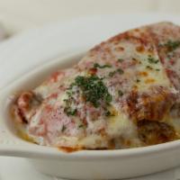 Eggplant Lasagna · Homemade no-pasta lasagna with eggplant, ricotta, mozzarella & meat in our tomato sauce.