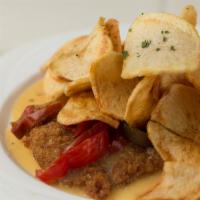 Veal Alla Nonna · Breaded veal cutlet, pan-fried with sweet vinegar peppers & sliced fried potatoes.