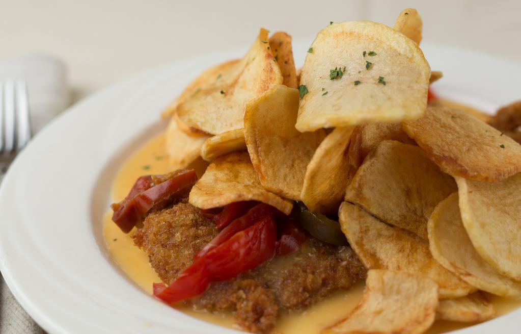 Veal Alla Nonna · Breaded veal cutlet, pan-fried with sweet vinegar peppers & sliced fried potatoes.
