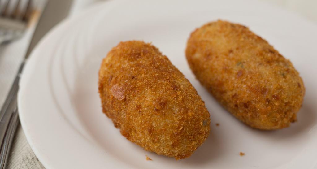 Potato Croquettes · Mashed potatoes stuffed with mozzarella cheese, then fried.