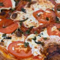 Margherita Pizza · Fresh mozzarella, tomatoes, fresh basil.
