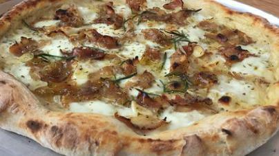 Porchetta Pizza · slow roasted pork belly and loin, broccoli rabe, hot banana peppers, vermont sharp cheddar, fontina