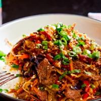 Bulgogi Bowl · Sliced marinated flank steak, onions, scallions, red bell peppers, carrots, green & red cabb...