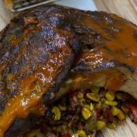 Baby Back Ribs · 1/2 rack ribs, mango chipotle barbeque sauce, chips, corn & bacon succotash