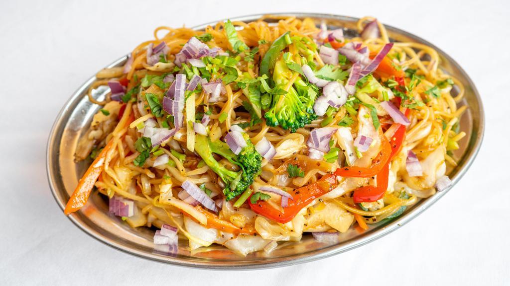 Vegetable Chow Mein · (Vegan). Stir fried noodles cooked with vegetables, onion, ginger, garlic, ketchup, soy sauce and chow mein masala.