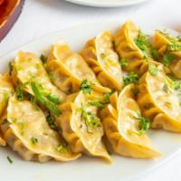 Vegetable Momos (Dumpling) · Minced vegetables mixed with onions, ginger, garlic, momo masala, and wrapped in dough and s...