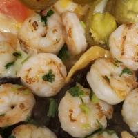 Shrimp Nachos · Home-made white corn tortilla chips covered with melted cheese salsa jalapenos black beans a...