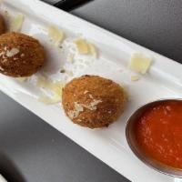 Arancini · crispy risotto balls in crushed tomato sauce