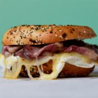 Pastrami, Egg & Cheese · House-Smoked Pastrami, Two Fried Eggs & Cheddar on a Wood-Fired Bagel.