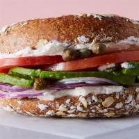 The Veggie Bagel · Veggie Cream Cheese, Avocado, Tomato, Red Onion, Cucumber & Capers on a Wood-Fired Bagels