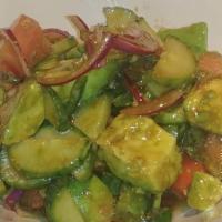 Avocado Salad · Pieces of avocado mixed with tomatoes, onions, jalapeños, and house dressing.