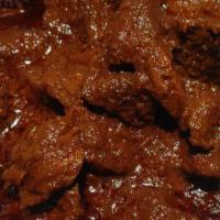 Sega Wot · Diced lean beef seared on a hot skillet, then slow-cooked in a berbere stew (served with two...