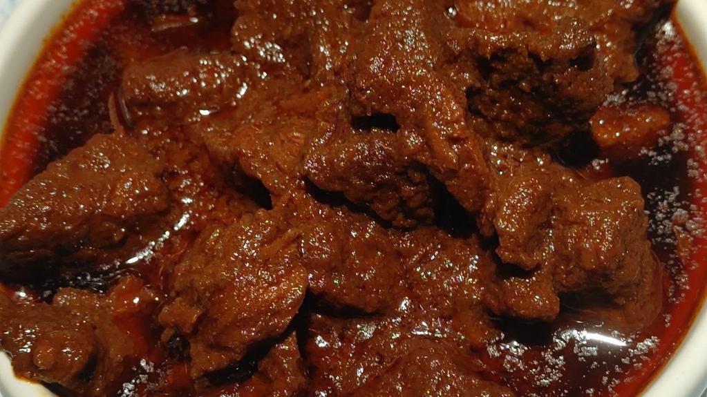 Sega Wot · Diced lean beef seared on a hot skillet, then slow-cooked in a berbere stew (served with two choices of vegetarian sides and injera)