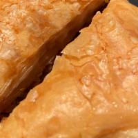 Baklava (2 Pieces) · Three pieces. Sweet pastry made of layers of phyllo dough filled with chopped nuts and sweet...
