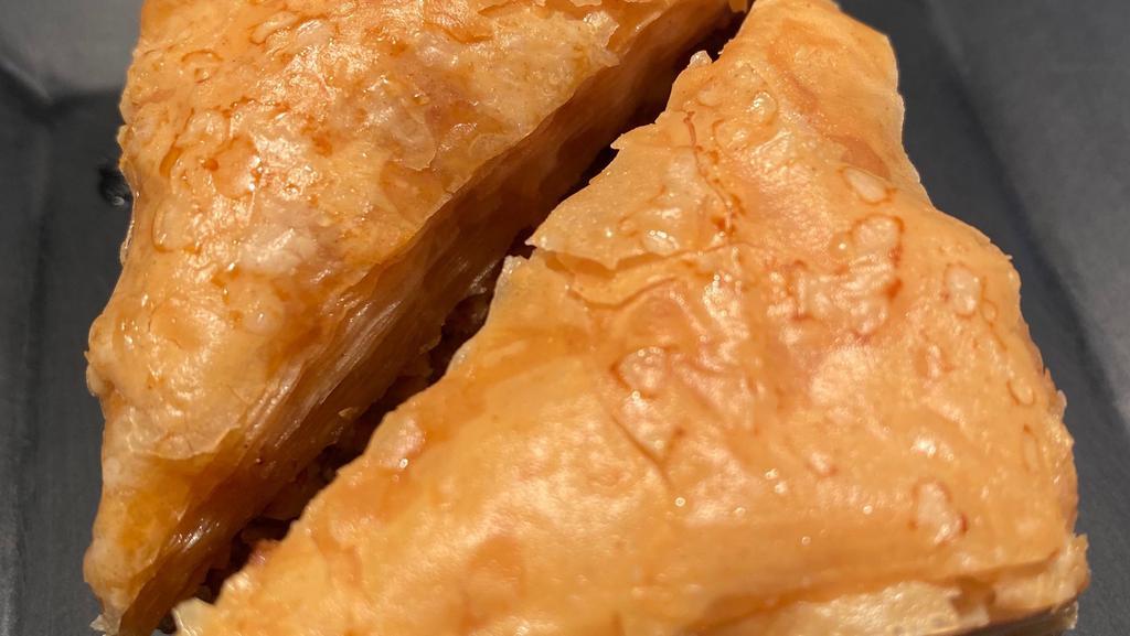 Baklava (2 Pieces) · Three pieces. Sweet pastry made of layers of phyllo dough filled with chopped nuts and sweetened with syrup.