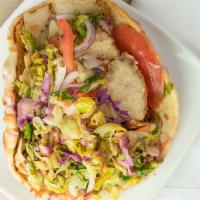 Chicken Gyro Sandwich · Rotisserie grilled slices of chicken, marinated, and charbroiled. Served in a flat bread wit...