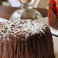 Warm Fallen Chocolate Cake · passion fruit drizzle, vanilla bean ice cream
