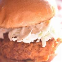 Nashville Hot Chicken Sandwich · Nashville hot and spicy glaze, pickles, coleslaw, and buttered brioche bun.