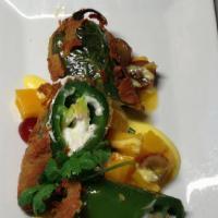 Angry Jalapeños (2) · Stuffed with goat cheese and mango salad.