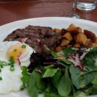 Skirt Steak & Eggs · Served with spring greens and crispy potatoes or rice and beans.