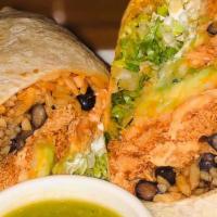 Grilled Rib Eye Burrito · Flour tortilla filled with rice, black beans, guacamole, sour cream, cheese and lettuce, ser...