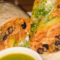 Shredded Beef Burrito · Flour tortilla filled with rice, black beans, guacamole, sour cream, cheese and lettuce, ser...