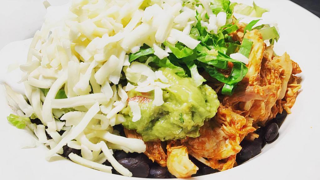 Shrimp Burrito Bowl · No tortilla. Includes rice, black beans, guacamole, sour cream, cheese and lettuce, served with tomatillo sauce.