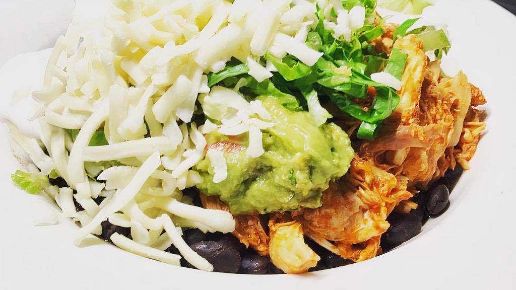 Vegetarian Burrito Bowl · No tortilla. Includes rice, black beans, guacamole, sour cream, cheese and lettuce, served with tomatillo sauce.