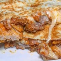Grilled Rib Eye Quesadilla · Flour tortilla folded with melted Jack cheese, served with guacamole, sour cream and salsa v...