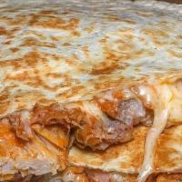 Shredded Beef Quesadilla · Flour tortilla folded with melted Jack cheese, served with guacamole, sour cream and salsa v...