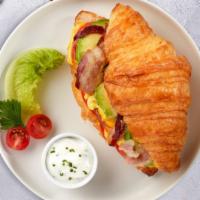 The Bacon Of Hope Breakfast Croissant · Scrambled egg, bacon, and cheddar cheese served on a croissant.