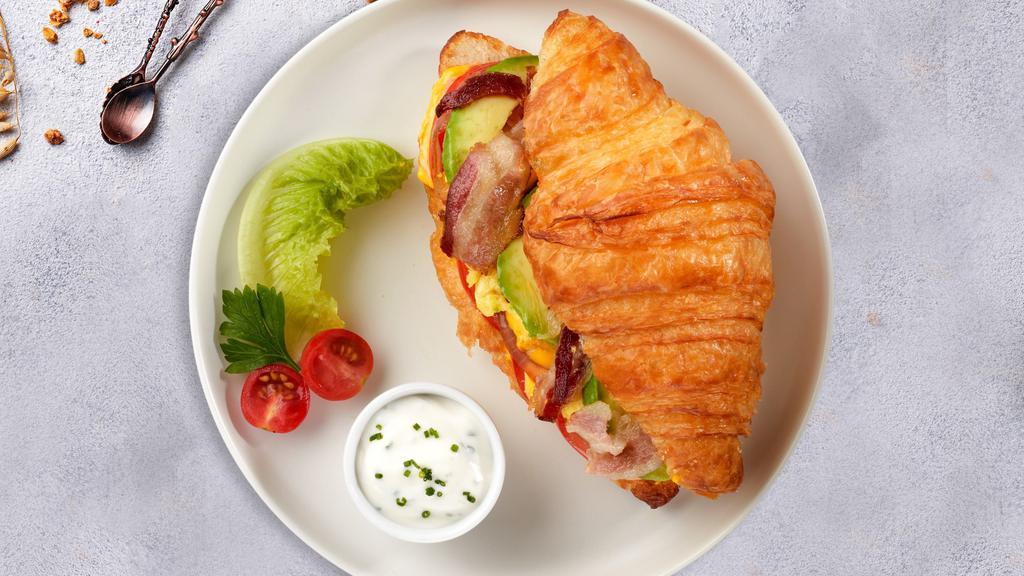 The Bacon Of Hope Breakfast Croissant · Scrambled egg, bacon, and cheddar cheese served on a croissant.